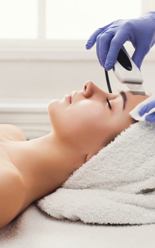 woman-getting-facial-treatment-at-beauty-salon.jpg